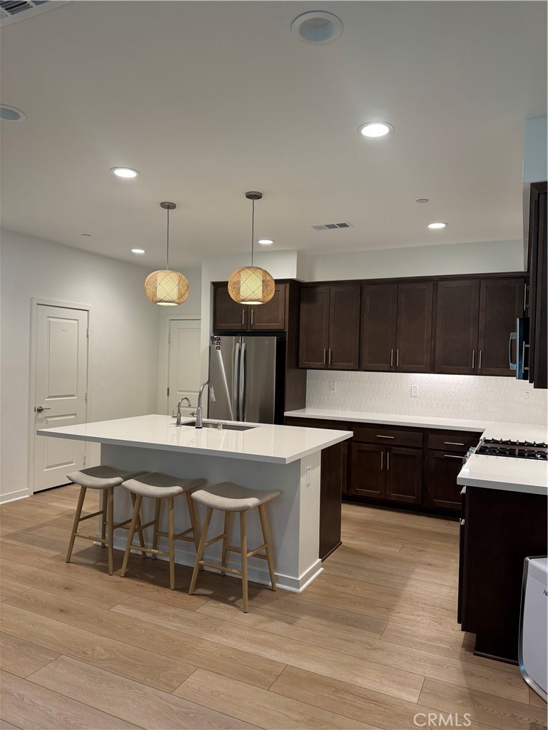 32412 Tannat Drive Temecula, CA 92591 - Photo 7 of 28 a large kitchen with a table and chairs