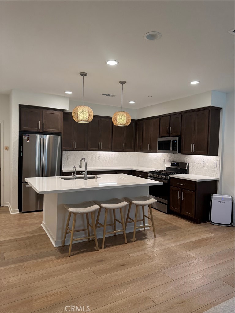 32412 Tannat Drive Temecula, CA 92591 - Photo 8 of 28 a large kitchen with a table and chairs