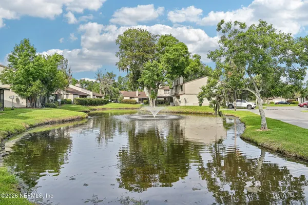 a view of a lake with a building in the background