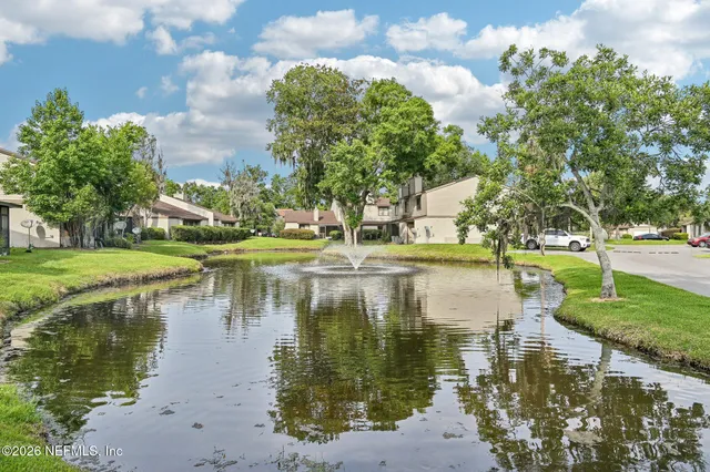a view of a lake with a building in the background