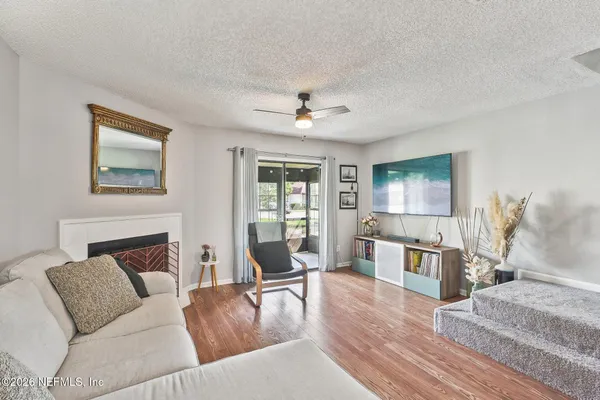 a living room with furniture and a fireplace