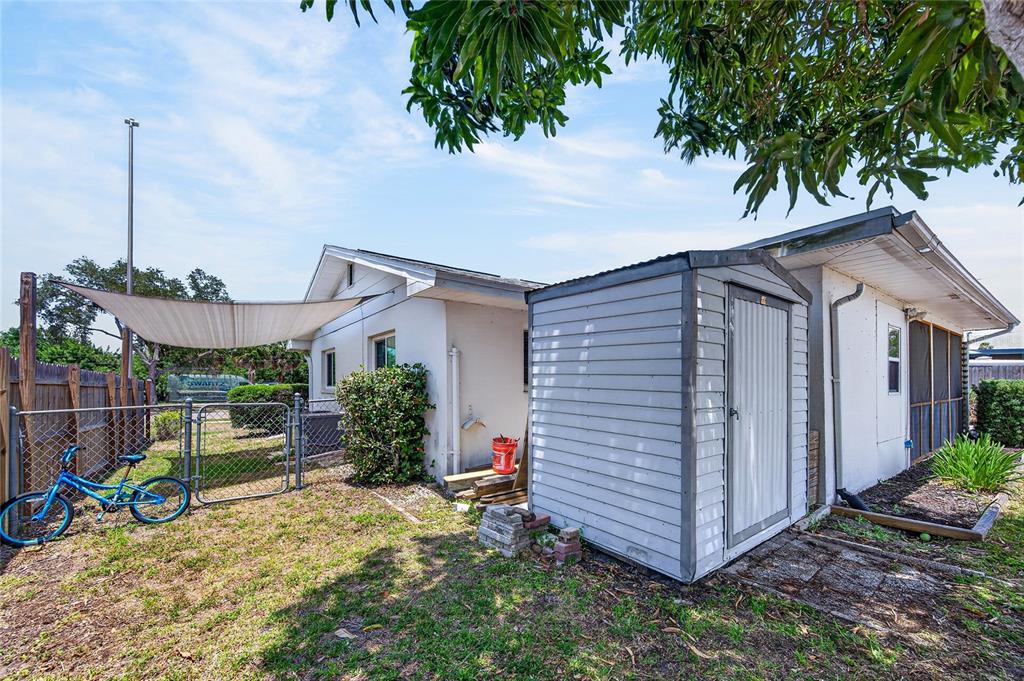 532 Center Road Venice, FL 34285 - Photo 55 of 68 a view of a house with a yard and potted plants