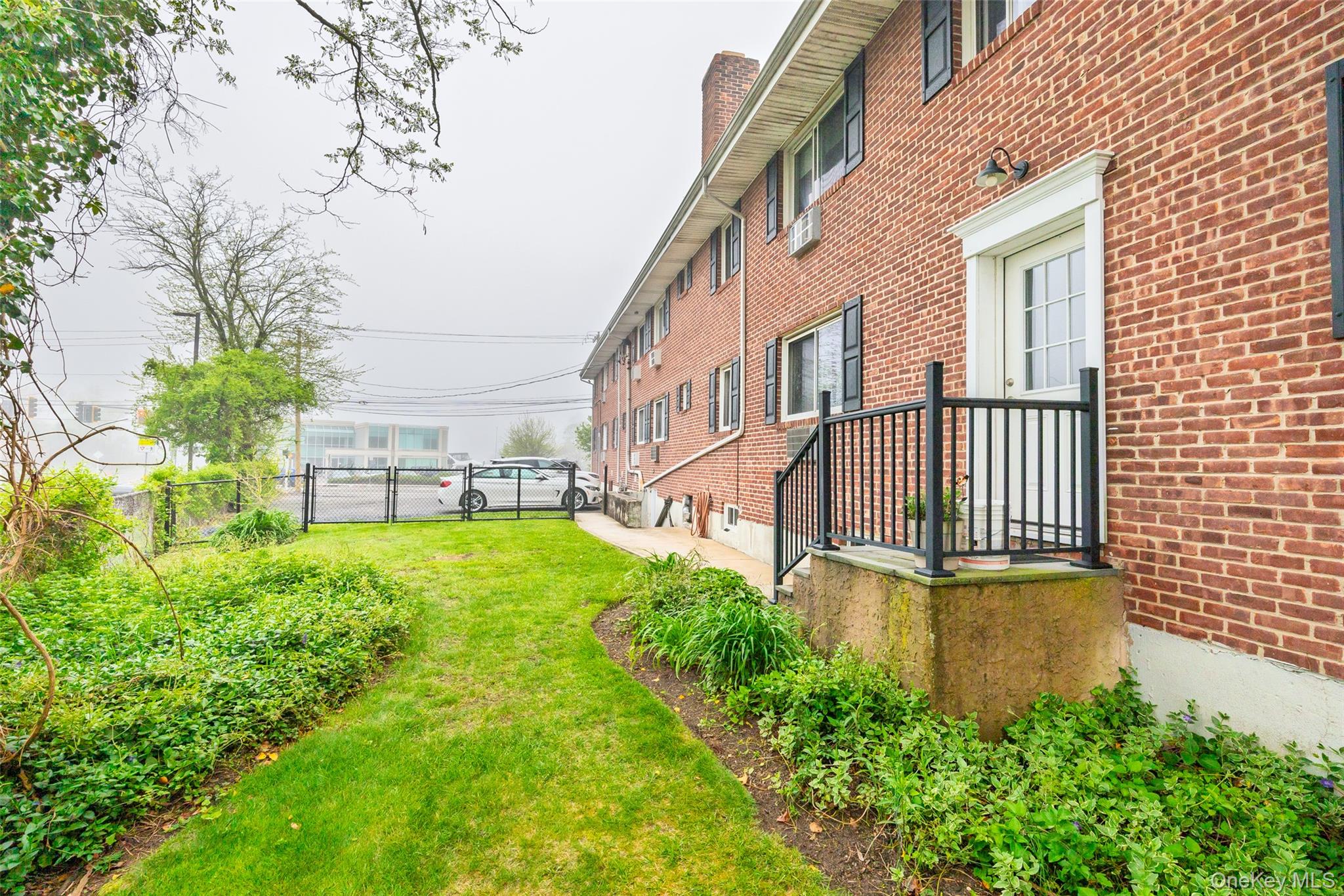 200 Merrick Road, Unit F Amityville, NY 11701 - Photo 10 of 32 Rear Entry close to Parking Space