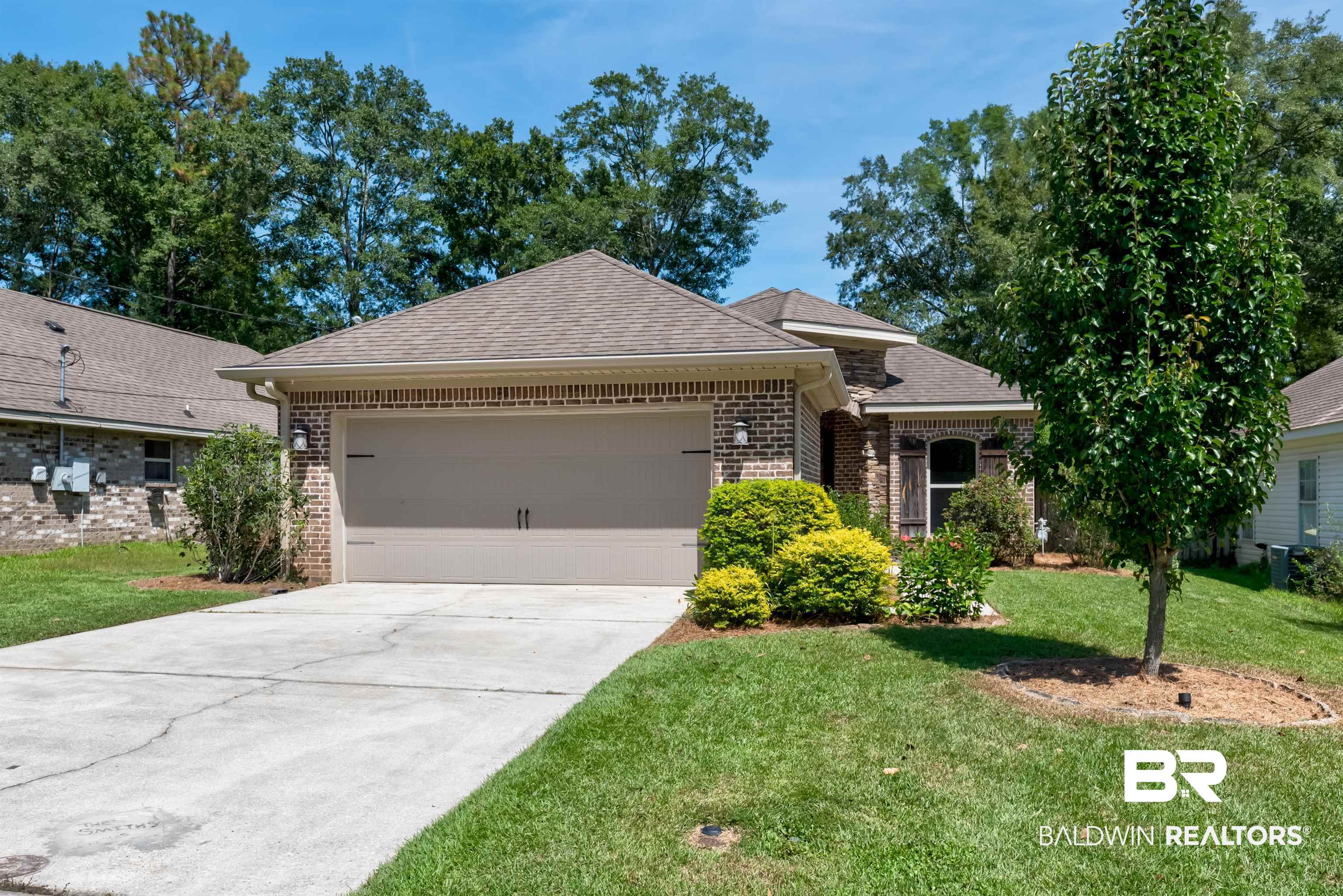 965 Henckley Avenue Mobile, AL 36609 - Photo 30 of 30 Ranch-style house featuring a garage and a front lawn