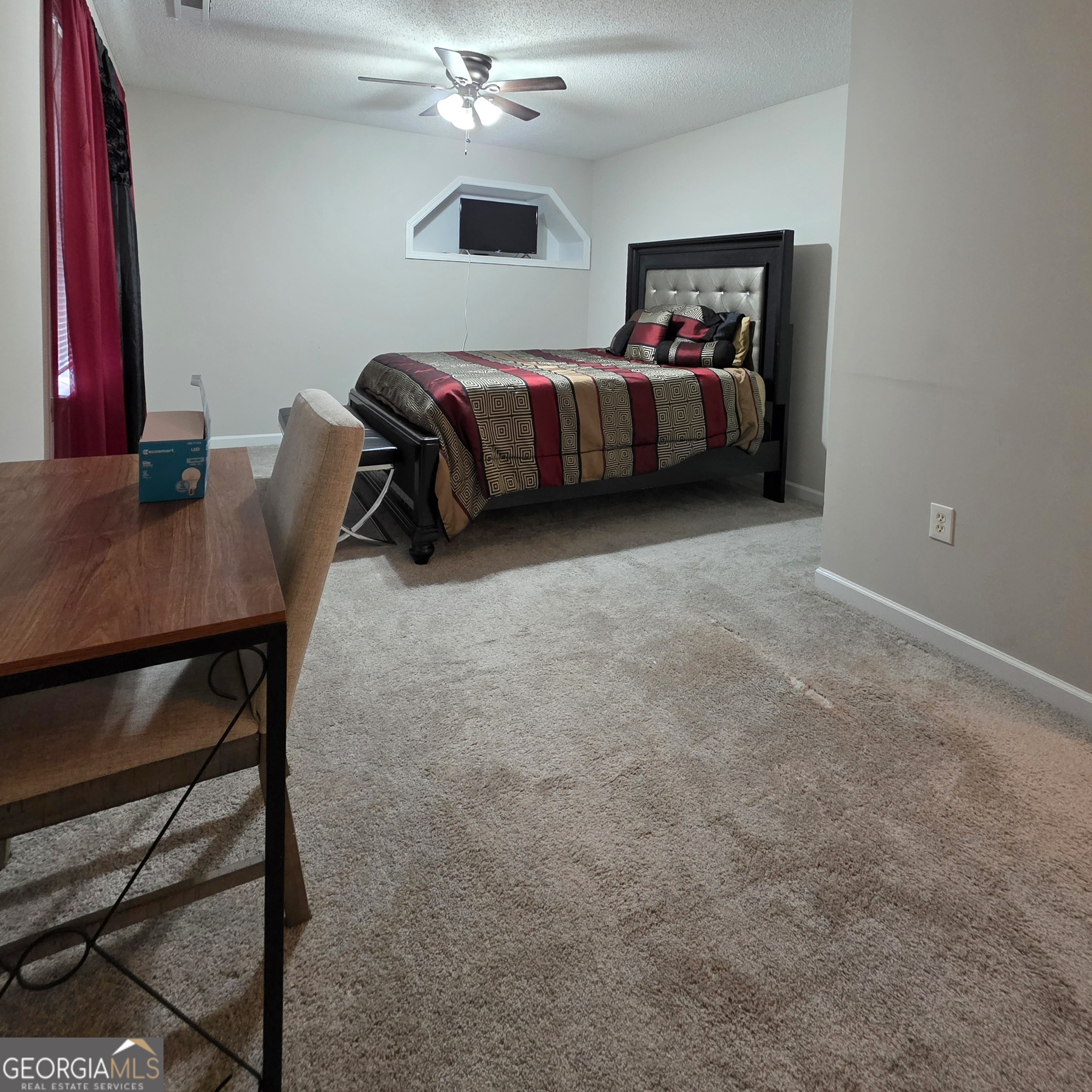 3117 Fairmond Court Villa Rica, GA 30180 - Photo 15 of 20 a bedroom with a bed and a table in it