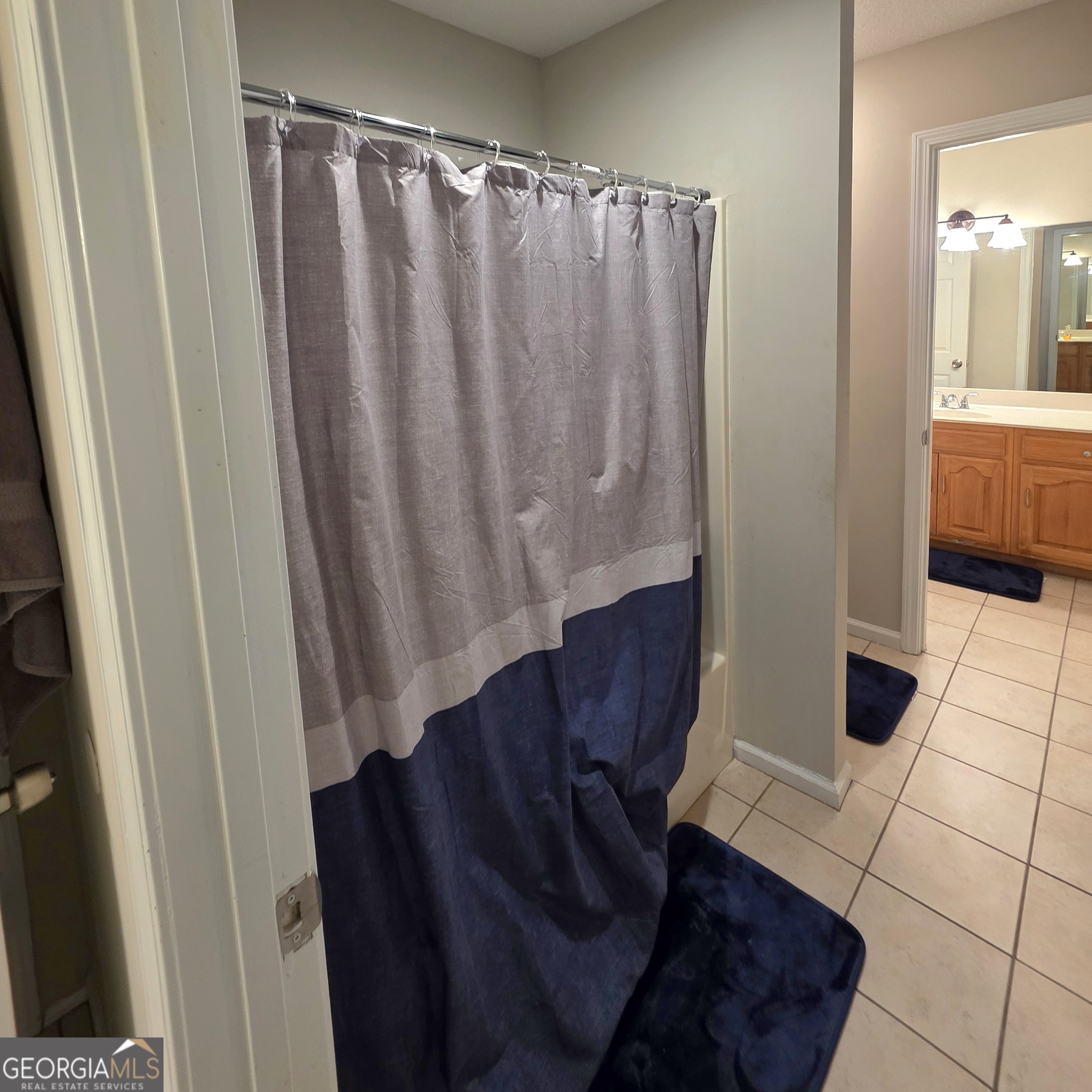 3117 Fairmond Court Villa Rica, GA 30180 - Photo 17 of 20 a view of a bathroom with sink and shower