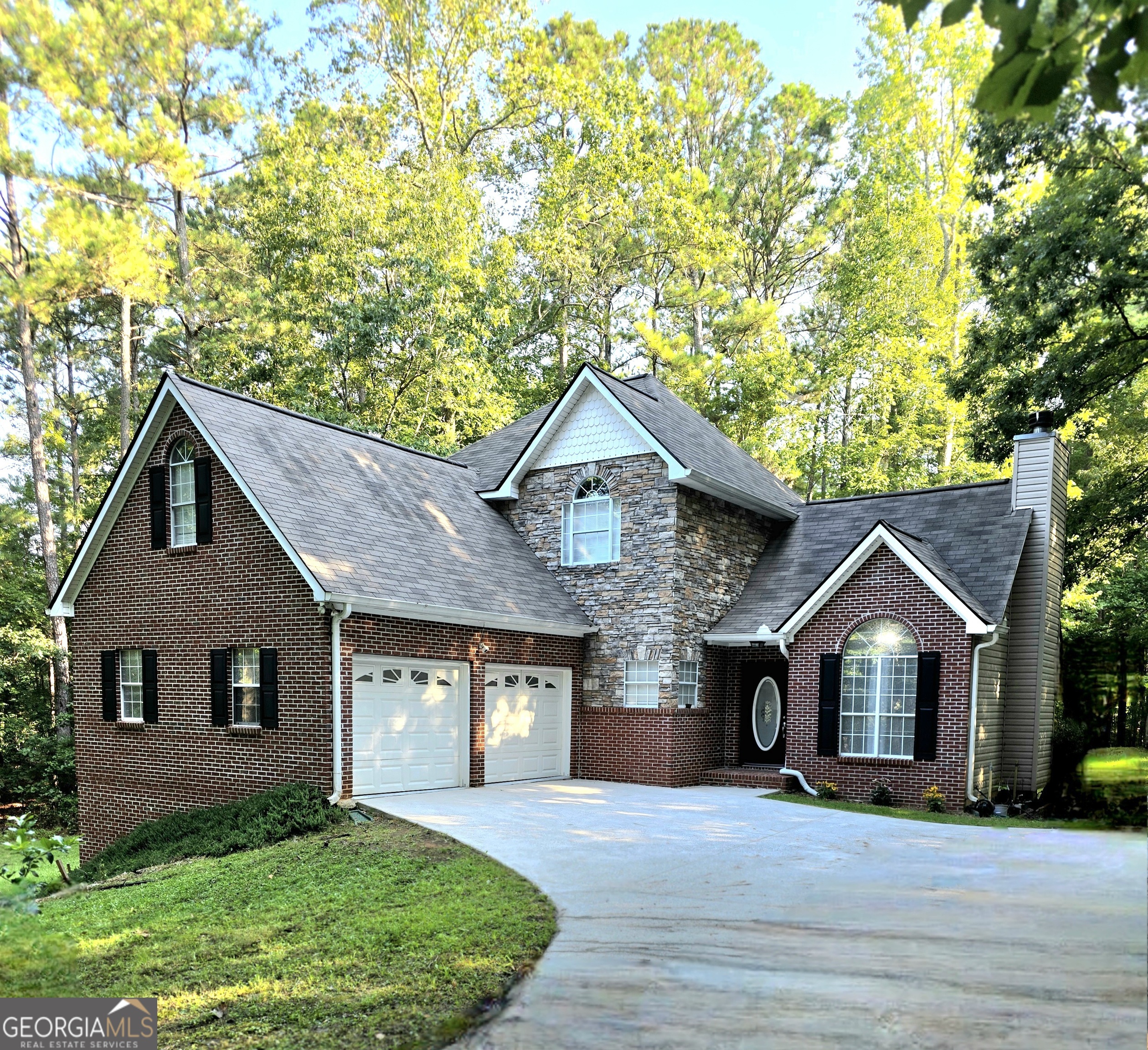 3117 Fairmond Court Villa Rica, GA 30180 - Photo 2 of 20 a front view of a house with a yard and garage