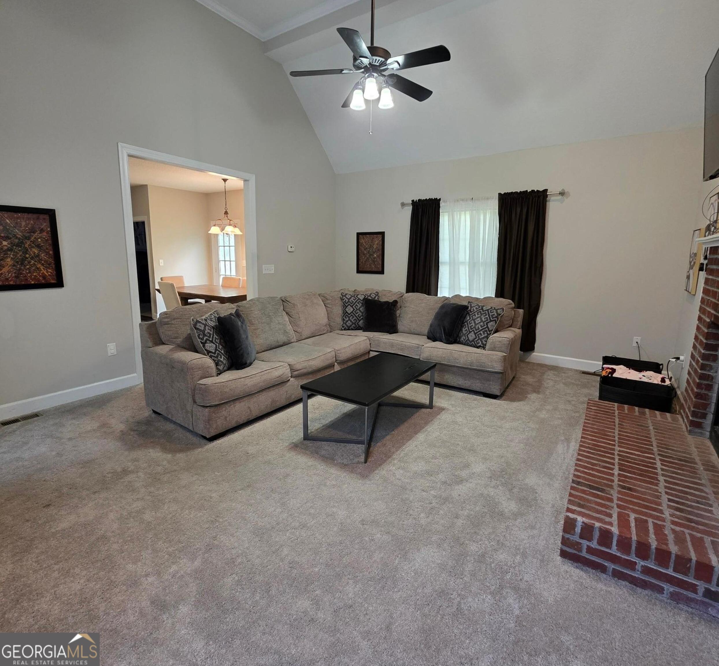 3117 Fairmond Court Villa Rica, GA 30180 - Photo 4 of 20 a living room with furniture and a flat screen tv