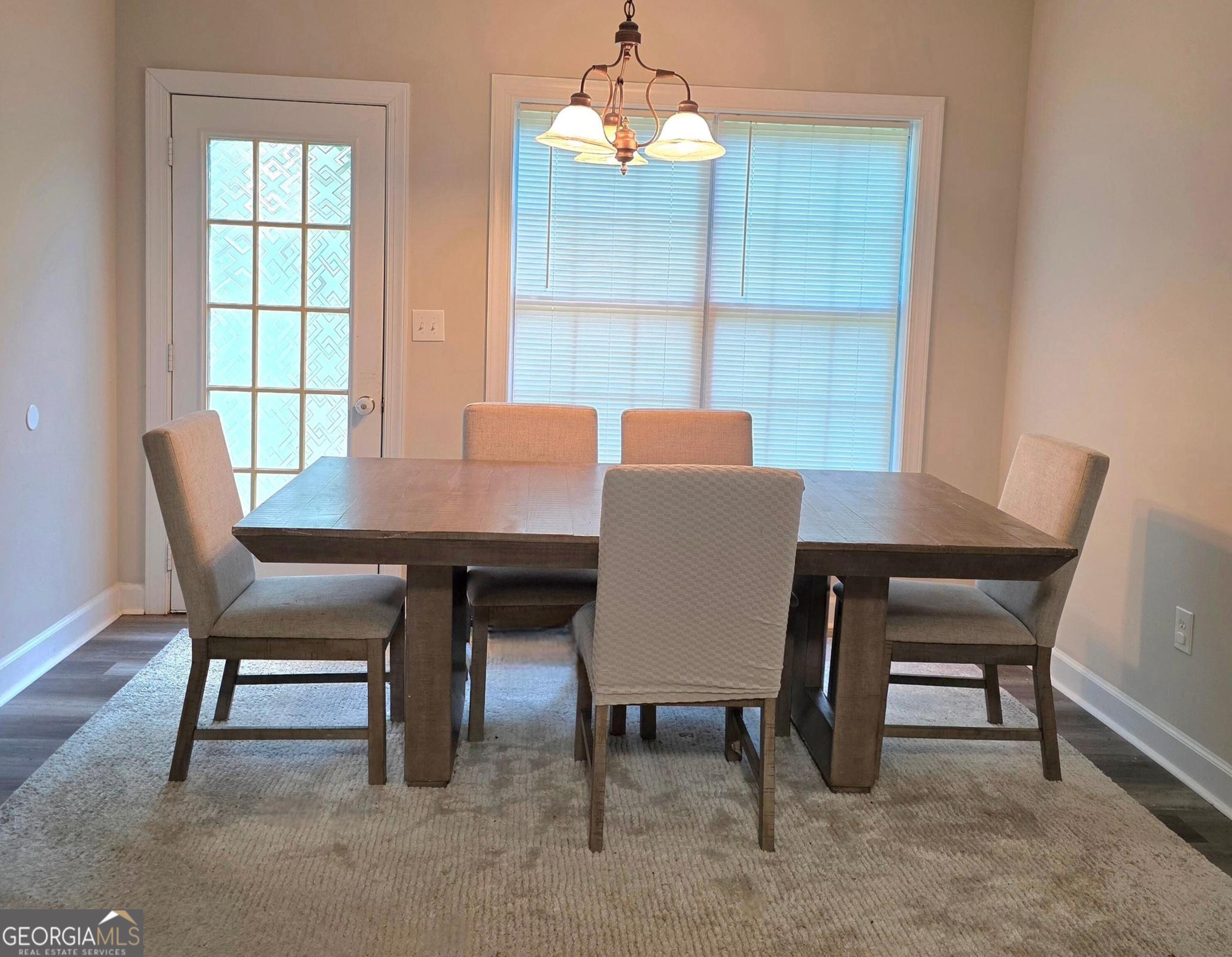 3117 Fairmond Court Villa Rica, GA 30180 - Photo 6 of 20 a view of a dining room with a table and chairs