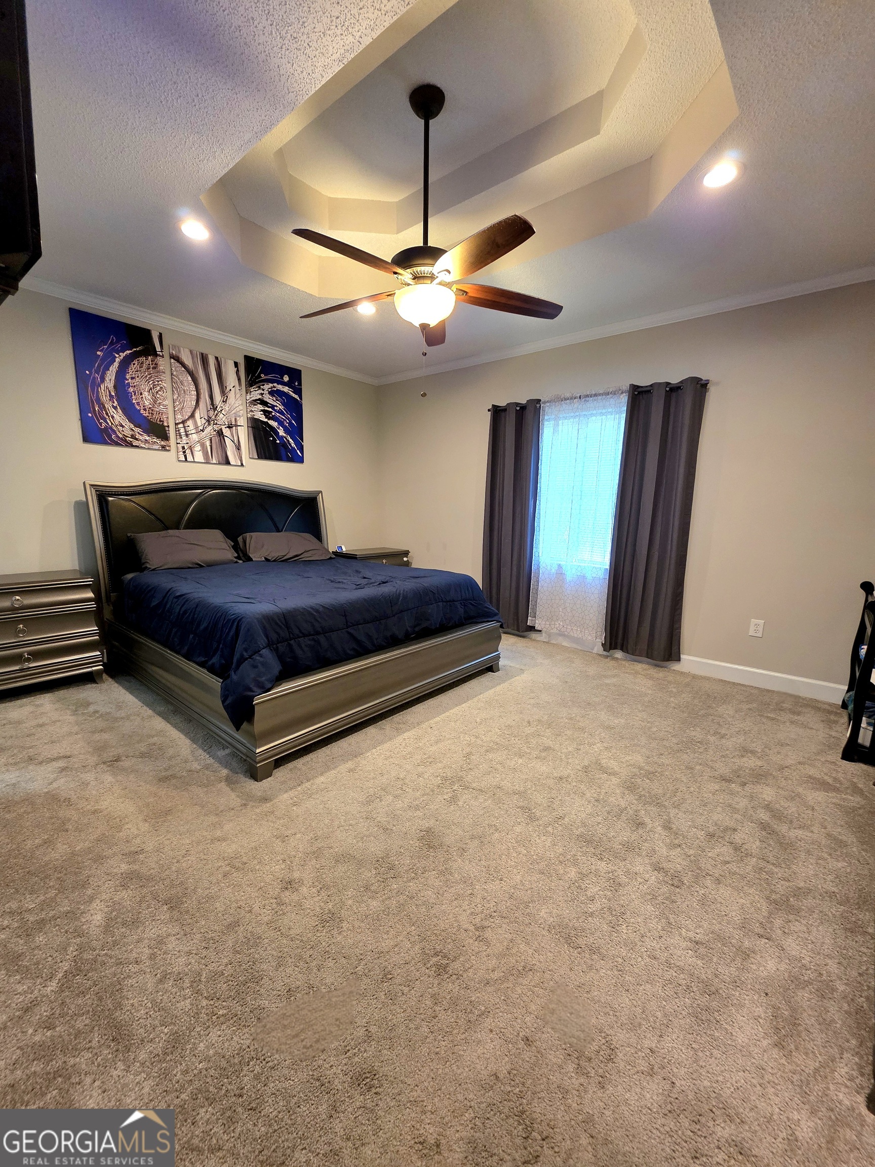 3117 Fairmond Court Villa Rica, GA 30180 - Photo 9 of 20 a bedroom with a bed and a chandelier