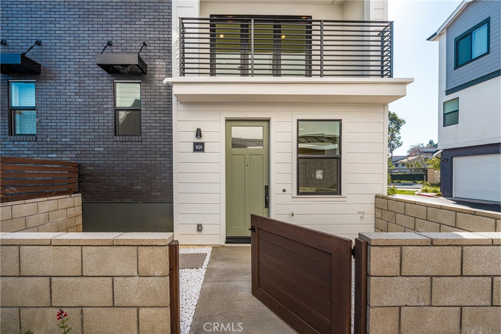 Modern coastal townhome with private gated entry in Huntington Beach.