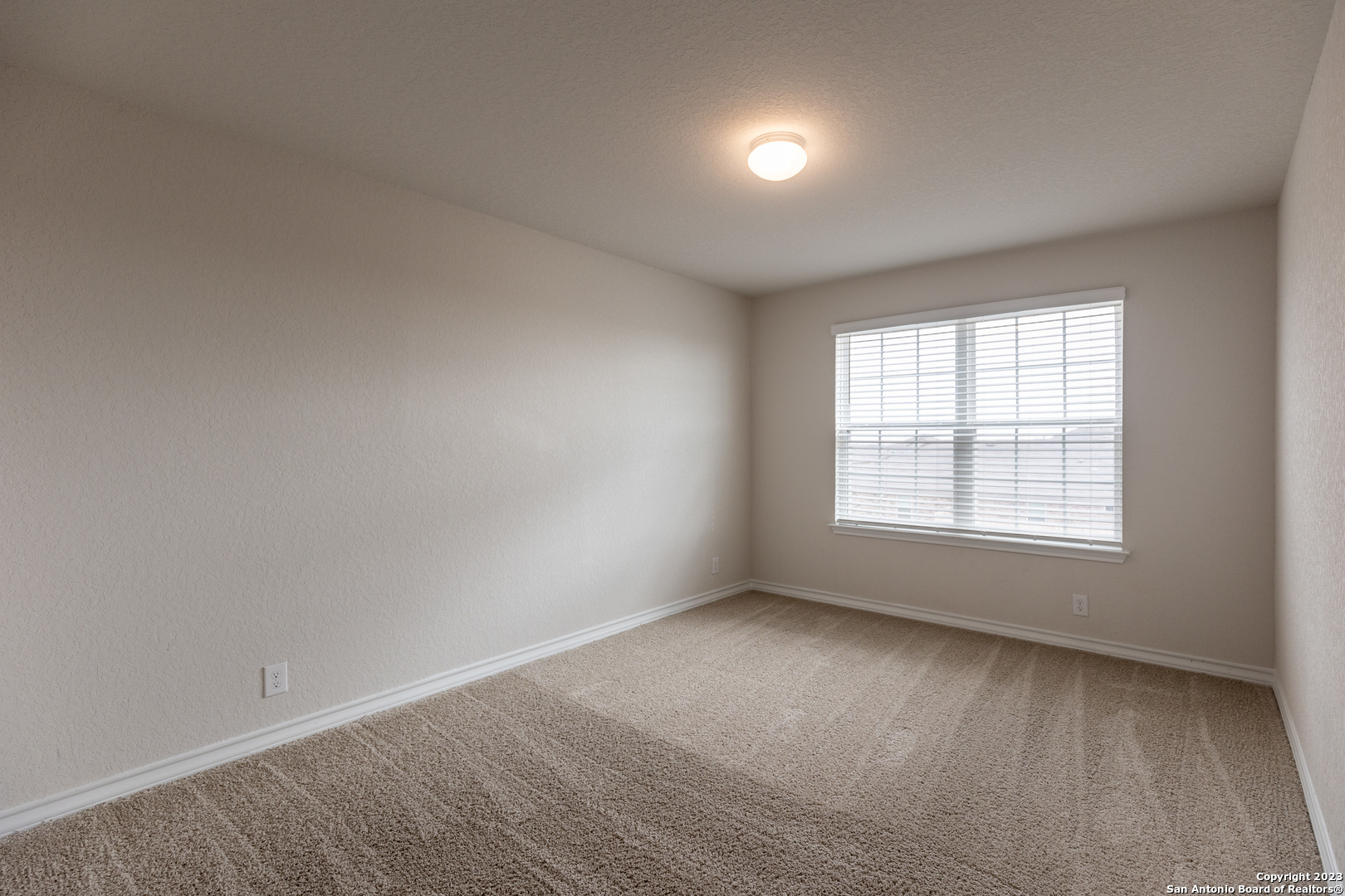 9819 Bratten Rise San Antonio, TX 78254 - Photo 27 of 37 an empty room with a window