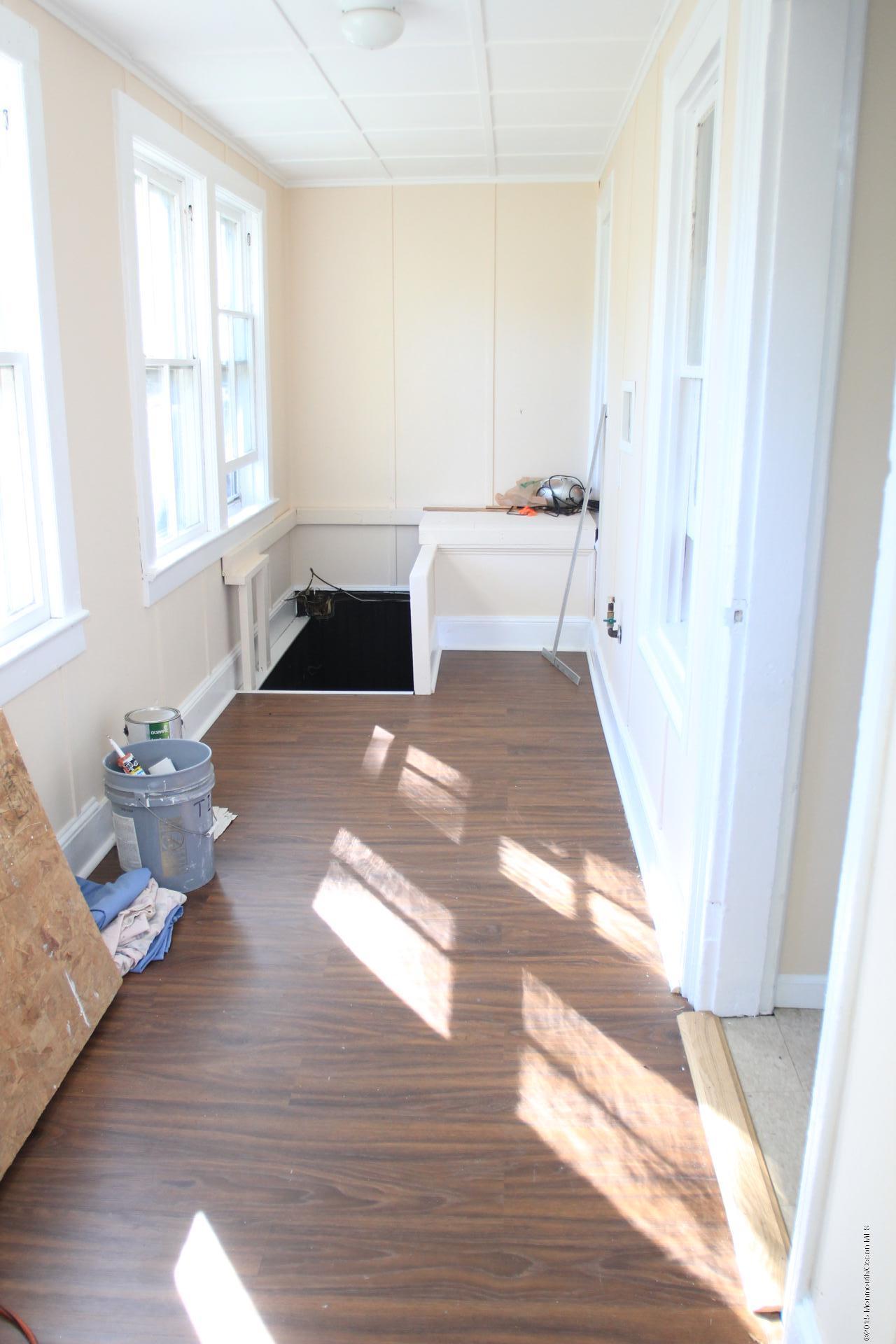 121 Branchport Avenue, Unit A Long Branch, NJ 07740 - Photo 12 of 21 a living room with furniture window and wooden floor