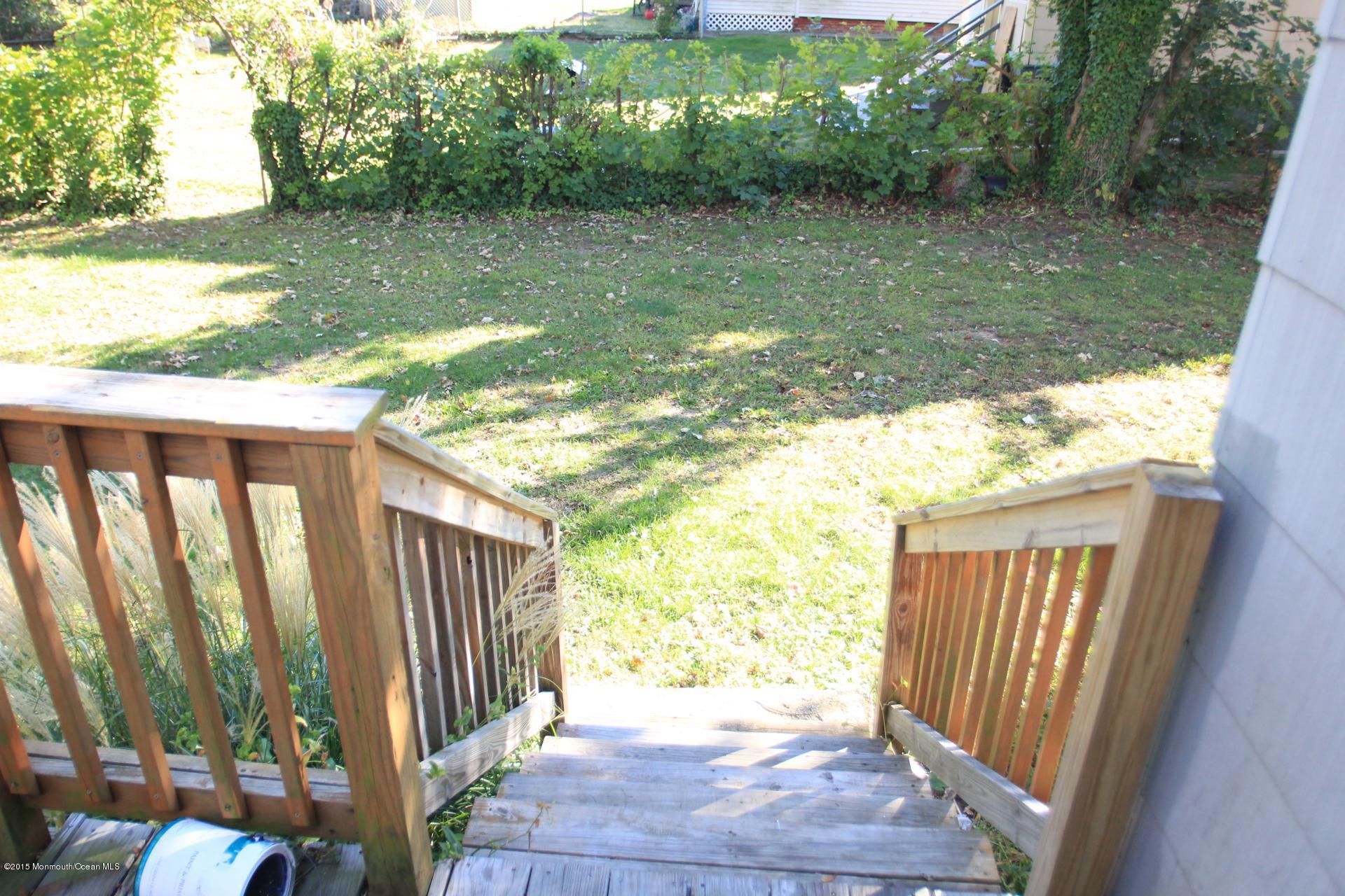 121 Branchport Avenue, Unit A Long Branch, NJ 07740 - Photo 14 of 21 a view of backyard with green space
