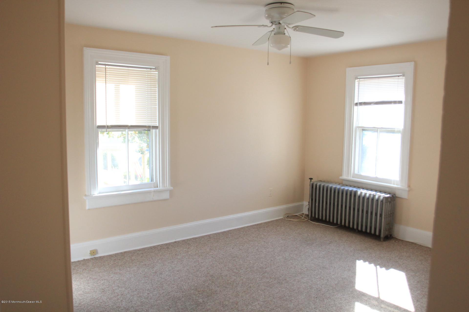 121 Branchport Avenue, Unit A Long Branch, NJ 07740 - Photo 15 of 21 an empty room with windows and fan