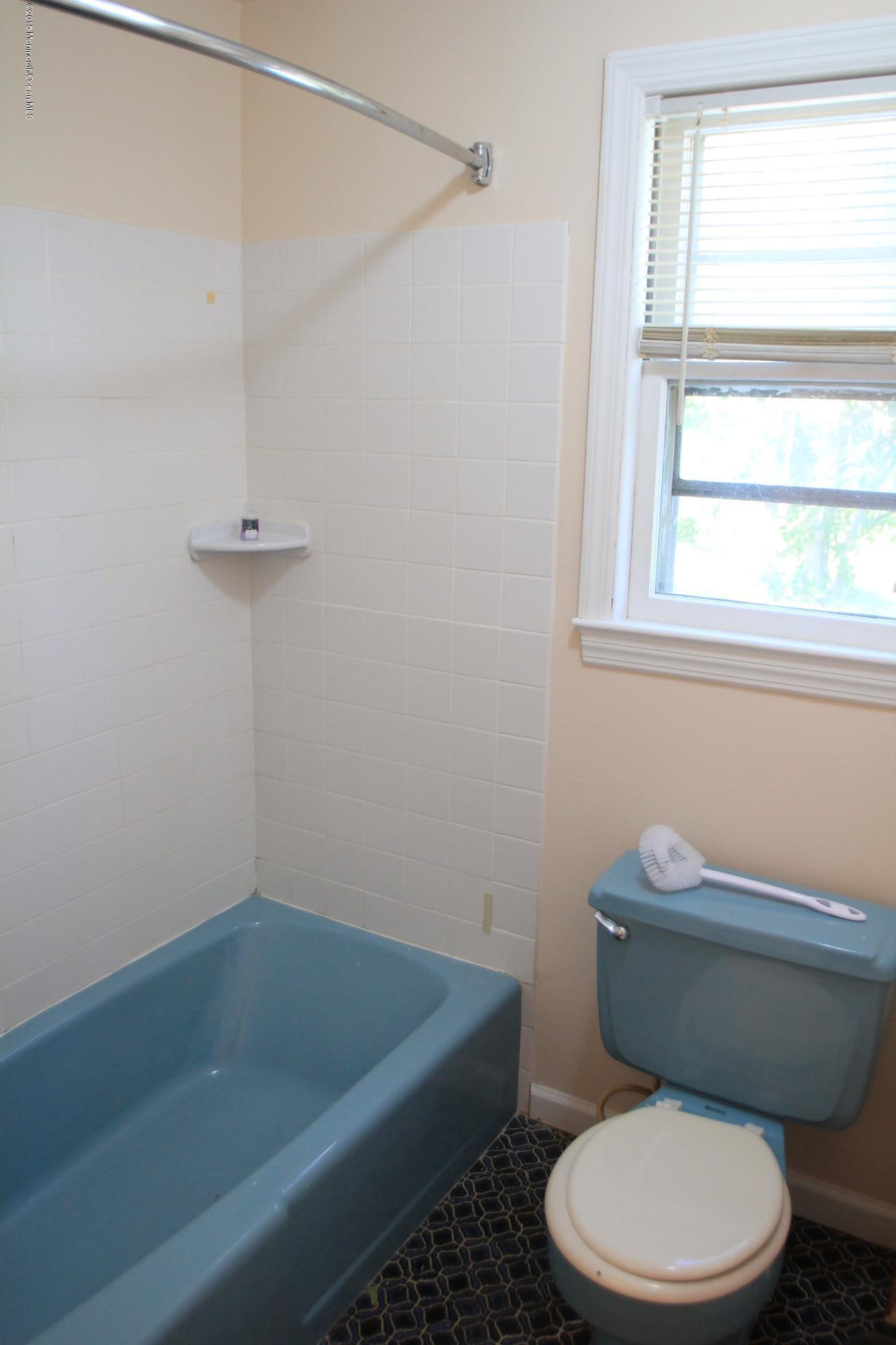 121 Branchport Avenue, Unit A Long Branch, NJ 07740 - Photo 19 of 21 a white toilet sitting next to a window