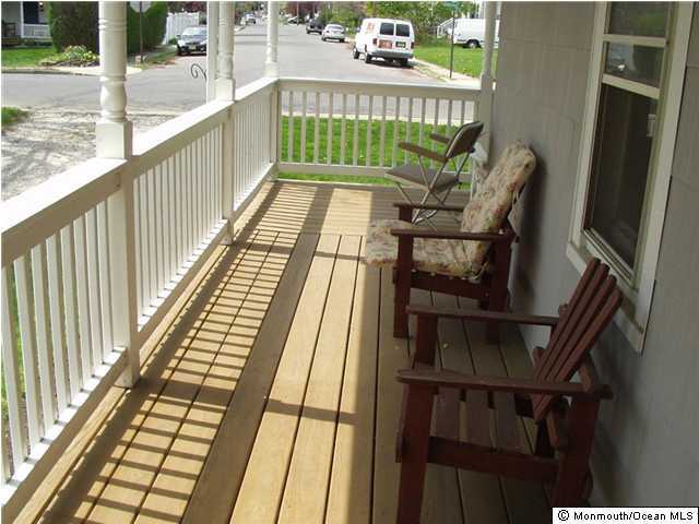 121 Branchport Avenue, Unit A Long Branch, NJ 07740 - Photo 2 of 21 a balcony with chairs