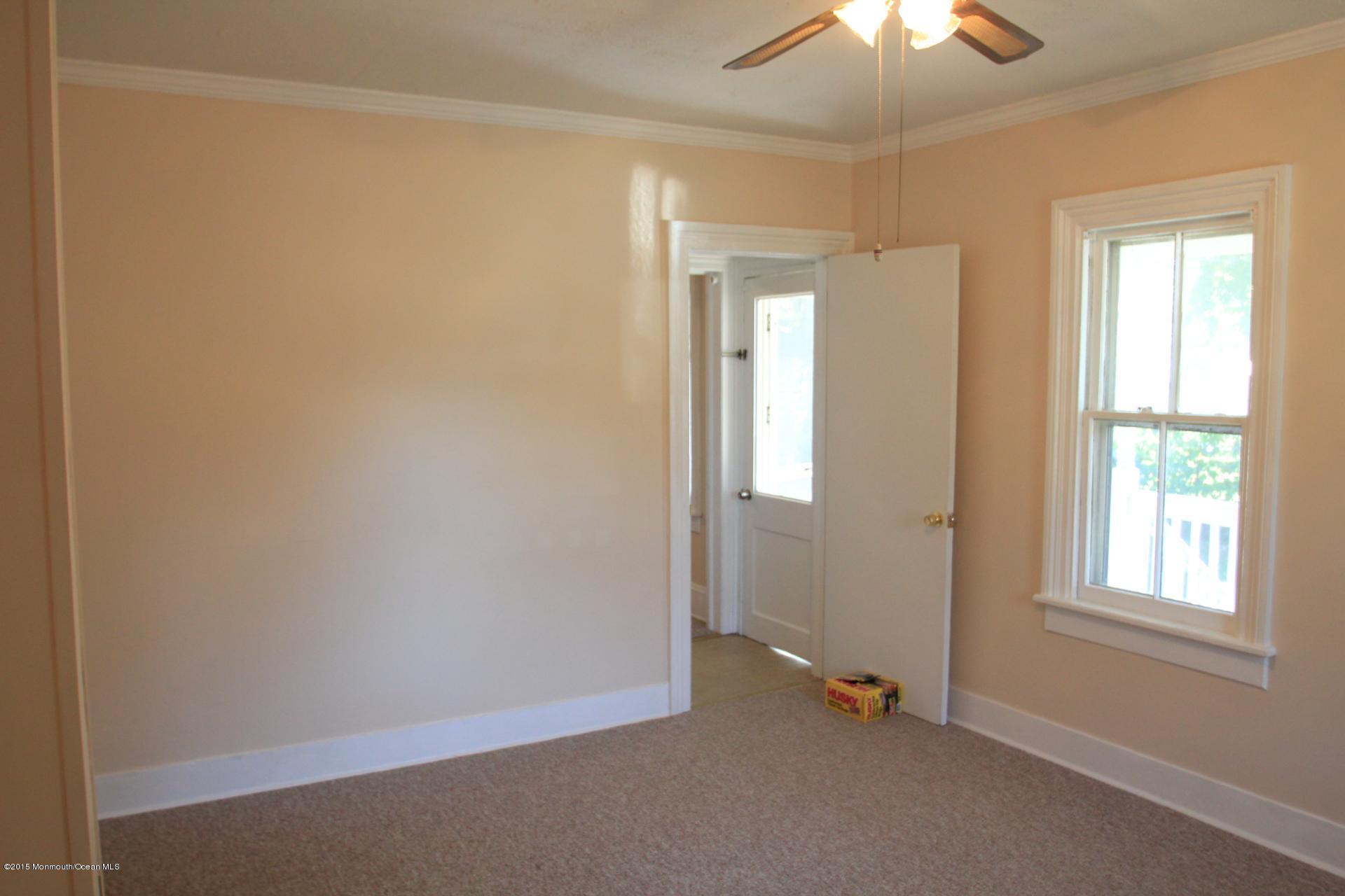121 Branchport Avenue, Unit A Long Branch, NJ 07740 - Photo 7 of 21 a view of an empty room with a window