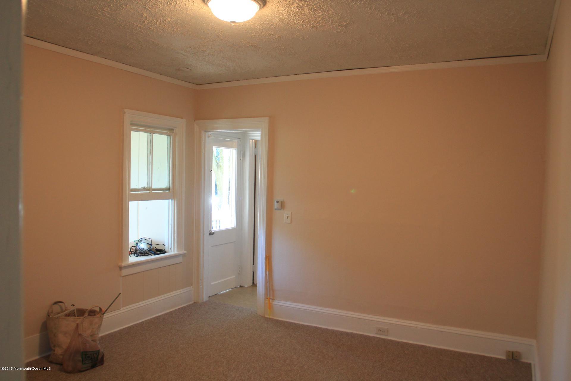 121 Branchport Avenue, Unit A Long Branch, NJ 07740 - Photo 9 of 21 a view of an empty room with window and closet area