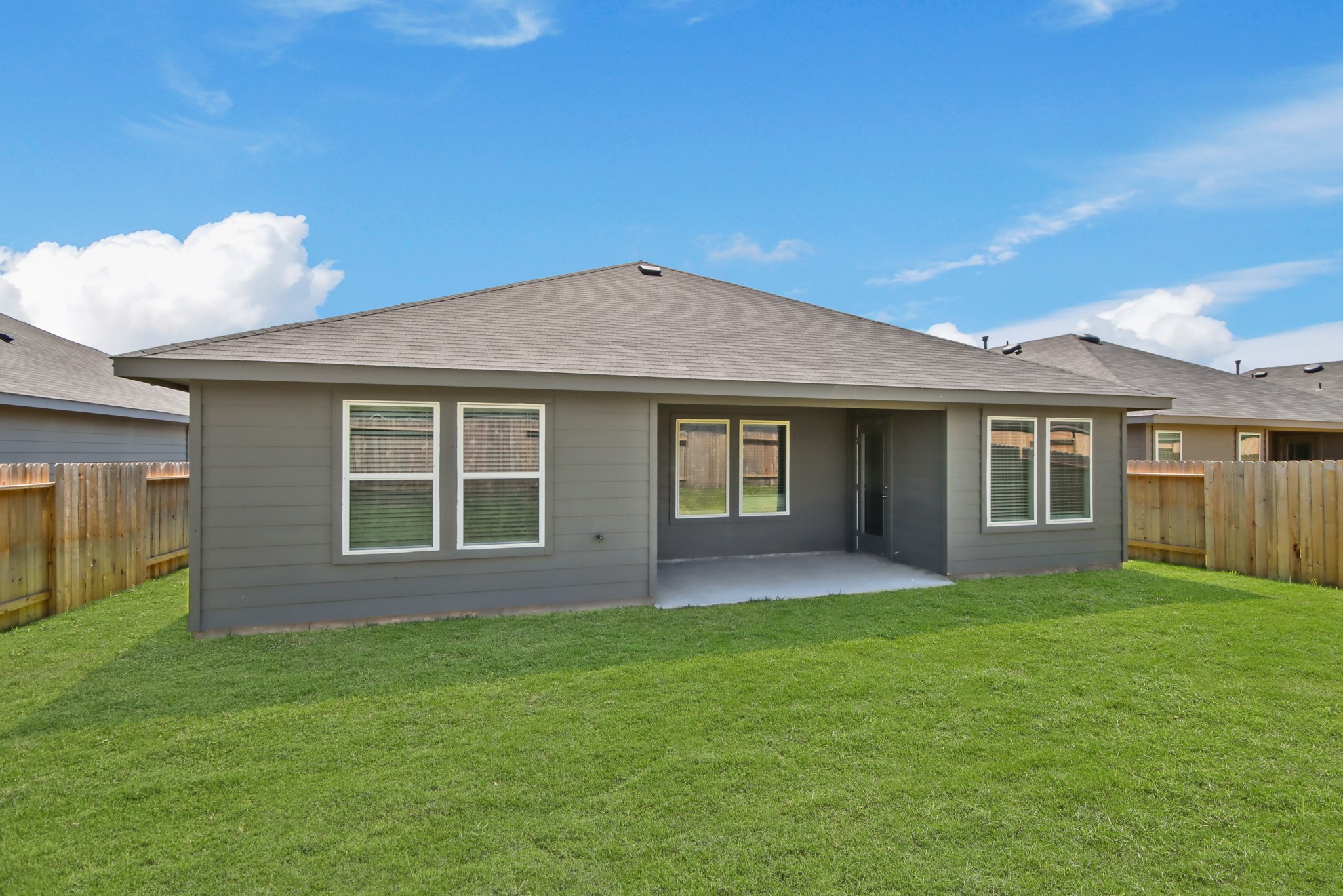 14368 Oceanblue Way Splendora, TX 77372 - Photo 12 of 22 a front view of a house with a garden