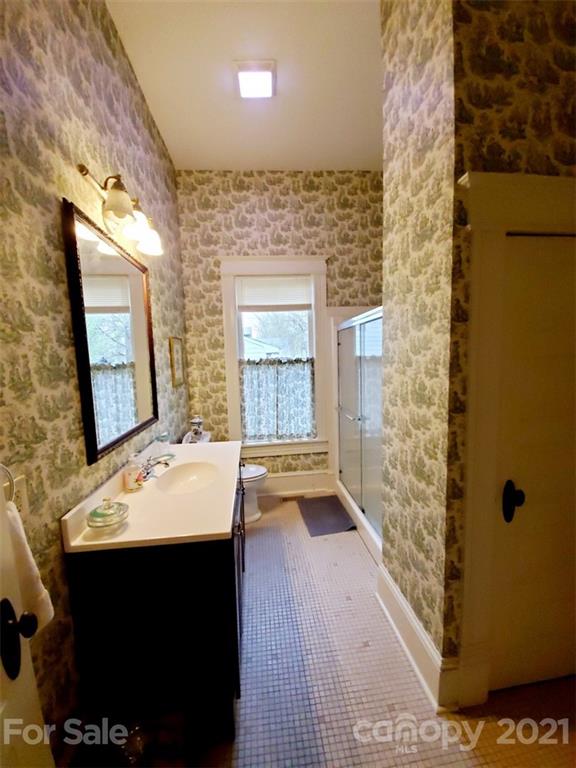 314 Mitchell Avenue Salisbury, NC 28144 - Photo 12 of 19 a bathroom with a sink a mirror and a shower