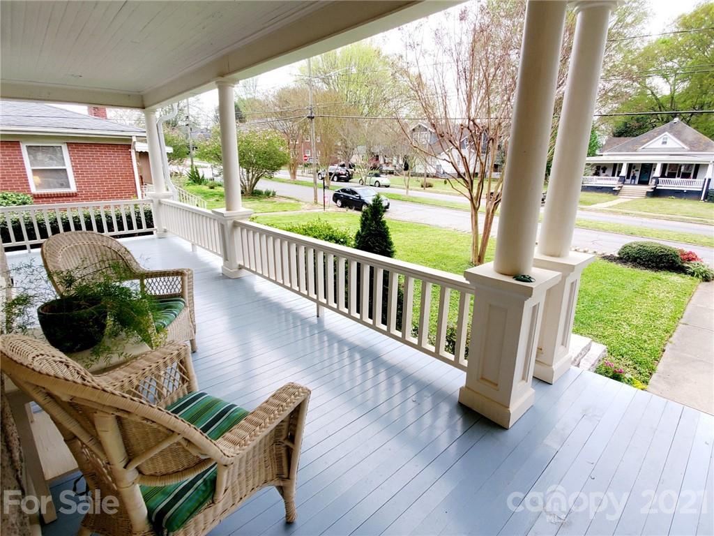 314 Mitchell Avenue Salisbury, NC 28144 - Photo 17 of 19 a view of a patio with table and chairs potted plants with wooden floor and fence