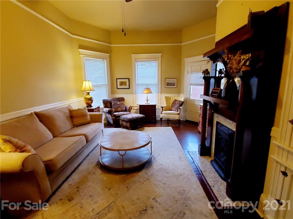 314 Mitchell Avenue Salisbury, NC 28144 - Photo 7 of 19 a living room with furniture and a fireplace