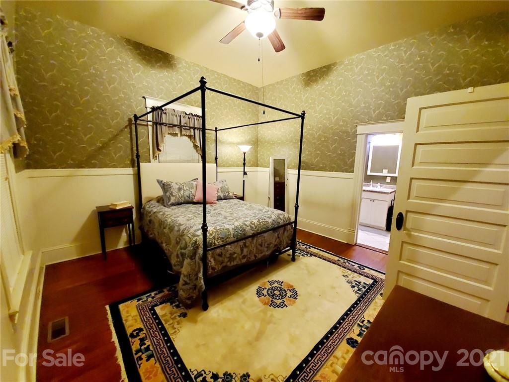314 Mitchell Avenue Salisbury, NC 28144 - Photo 9 of 19 a bedroom with a bed and a table