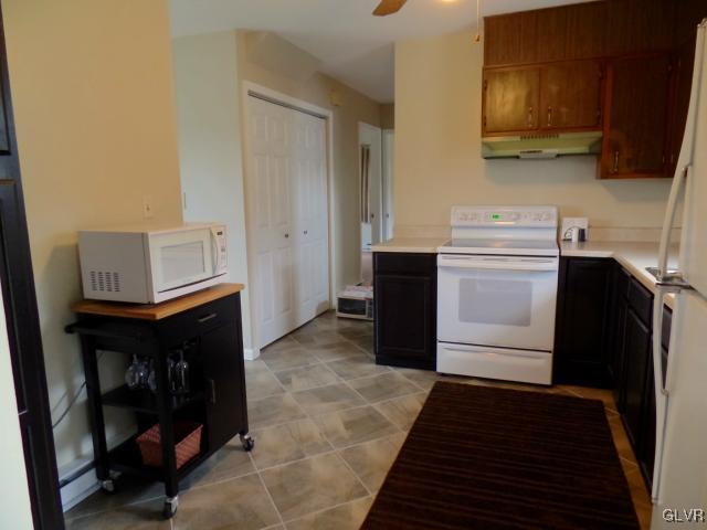 435 Nolf Road Nazareth, PA 18064 - Photo 5 of 14 a kitchen with a sink and a refrigerator