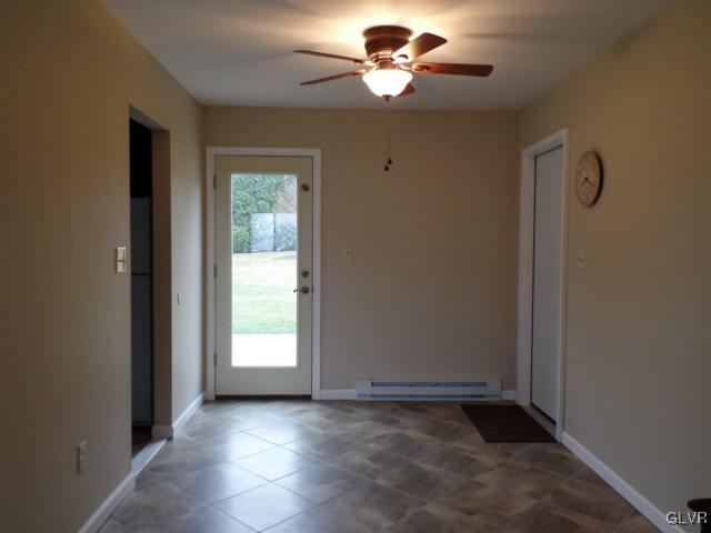 435 Nolf Road Nazareth, PA 18064 - Photo 6 of 14 an empty room with windows and chandelier fan