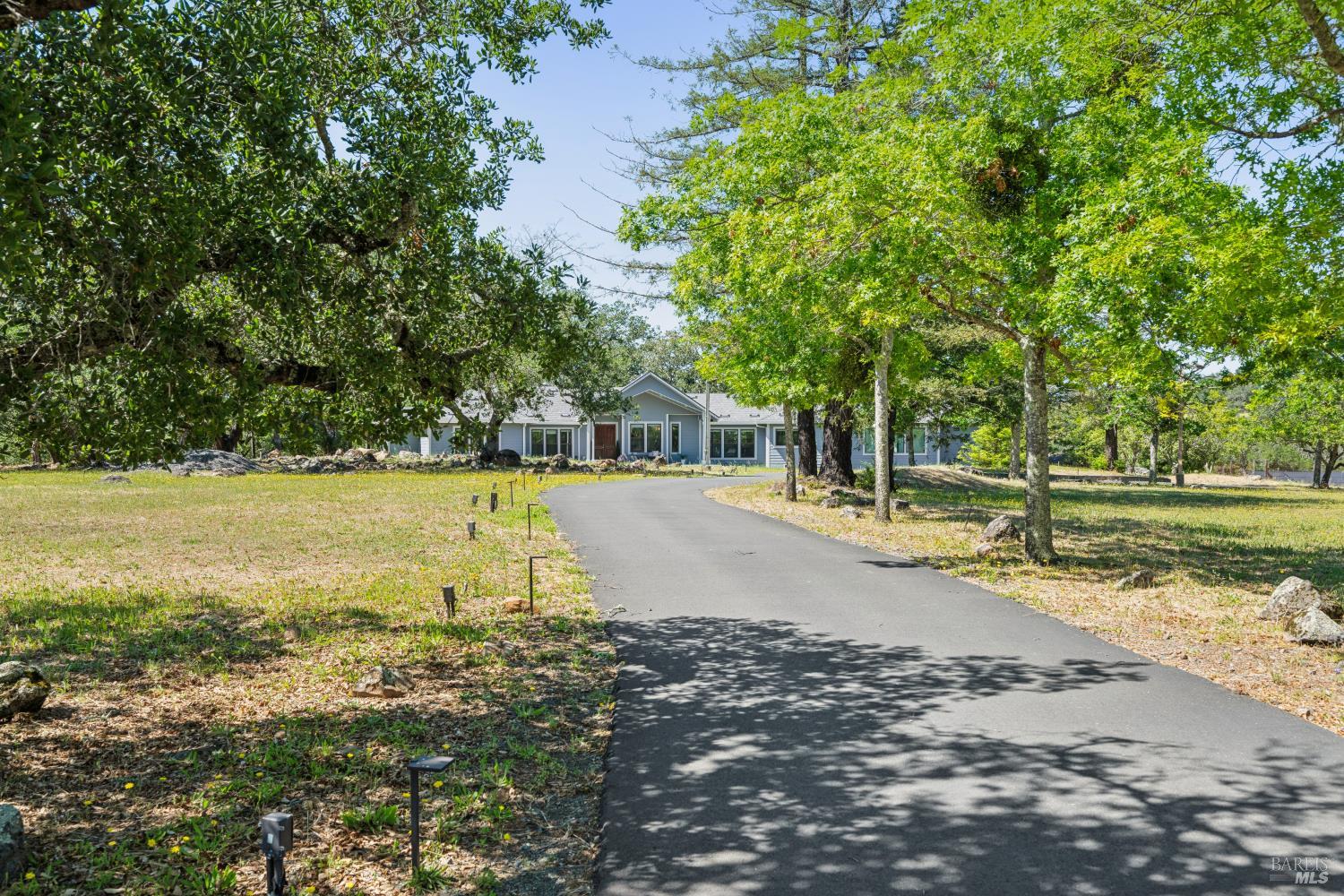 4665 Upper Ridge Road Santa Rosa, CA 95404 - Photo 62 of 71 a view of a swimming pool with a lawn chairs and trees