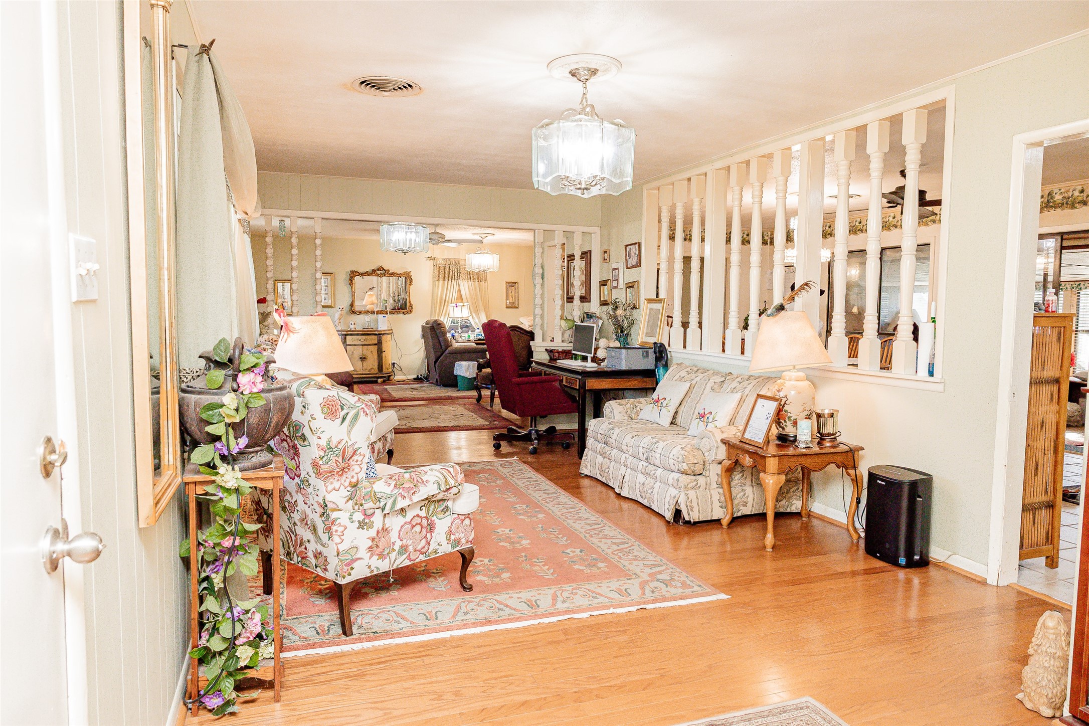 8608 Captain Scott Road Brenham, TX 77833 - Photo 3 of 28 a living room with furniture chandelier and a large window