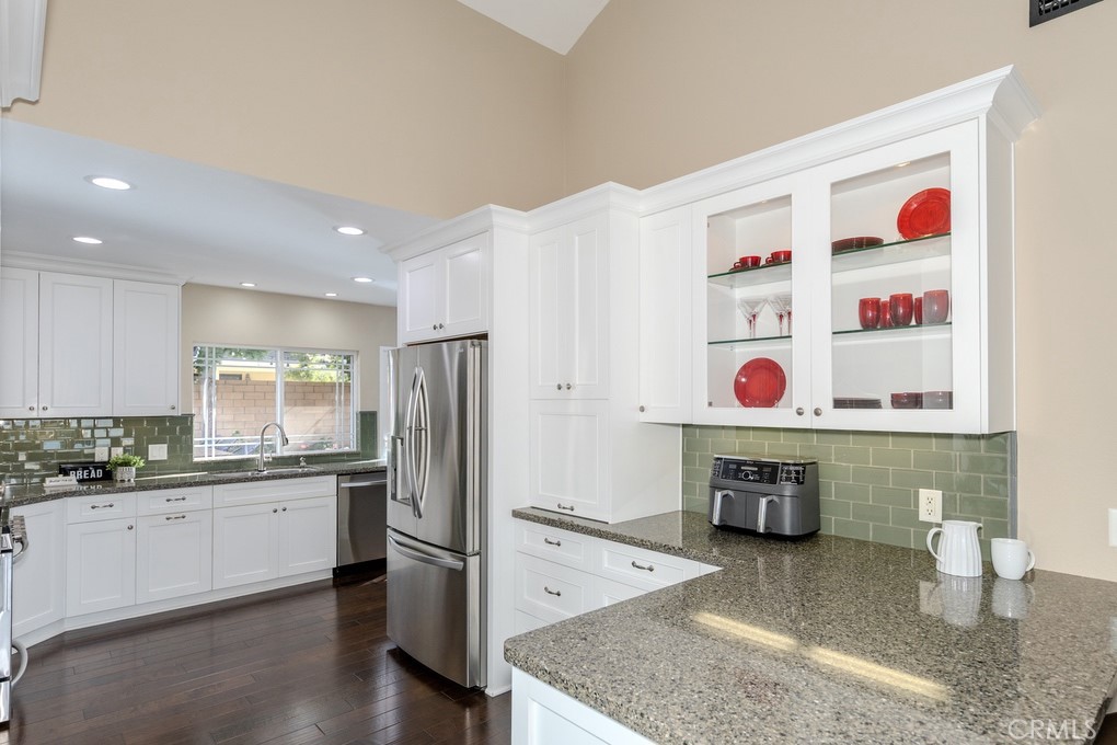 19542 Drybrook Lane Huntington Beach, CA 92646 - Photo 12 of 55 Kitchen has Quartz Countertops with Subway Tile Backsplash