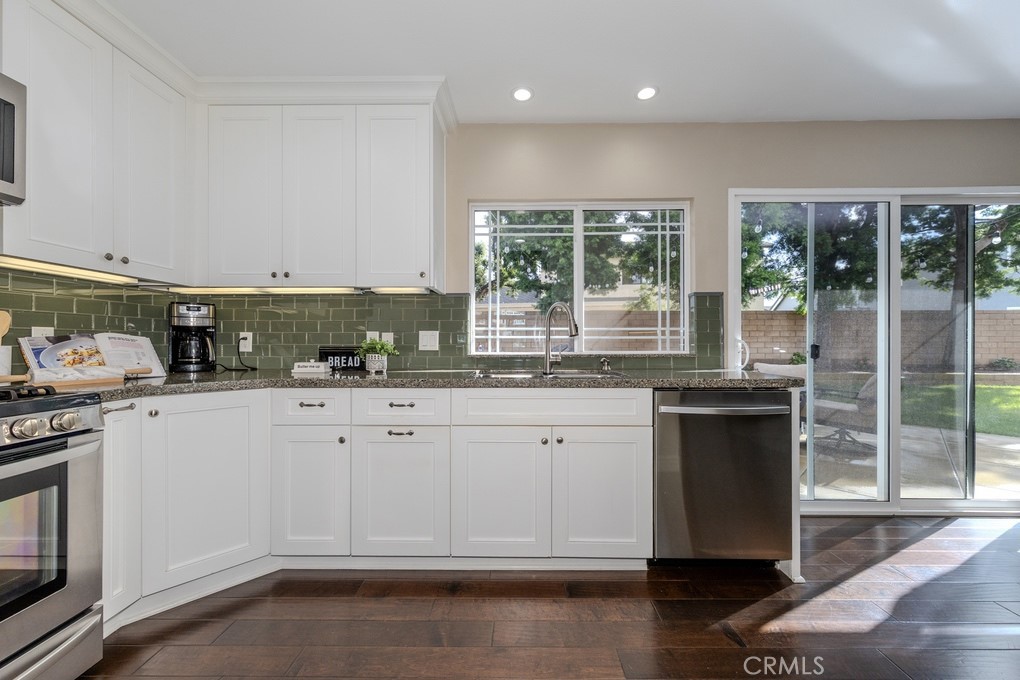 19542 Drybrook Lane Huntington Beach, CA 92646 - Photo 17 of 55 Under Cupboard Lighting and Sliders to the Backyard.