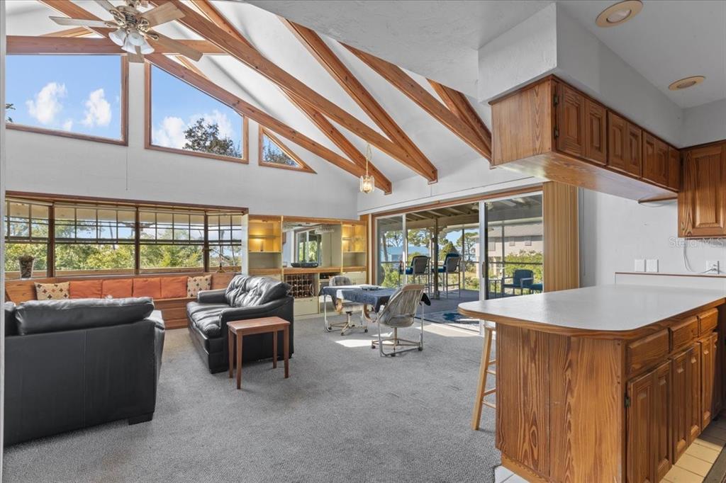 16791 Sandra Street Cedar Key, FL 32625 - Photo 16 of 50 a living room with furniture and a large window