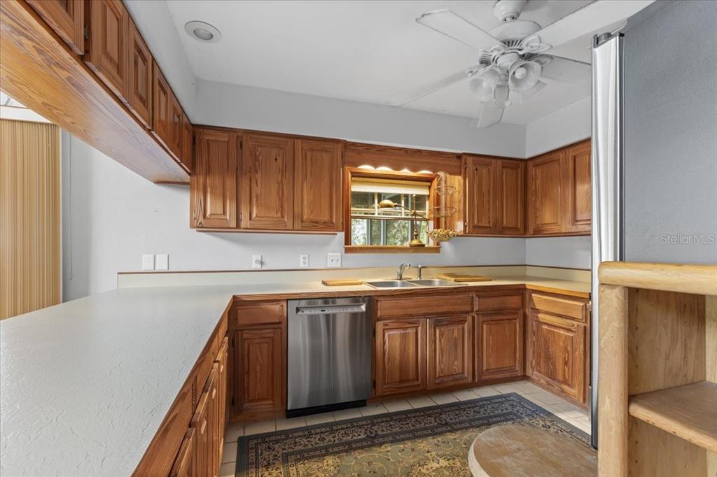 16791 Sandra Street Cedar Key, FL 32625 - Photo 17 of 50 a kitchen with a sink appliances and cabinets