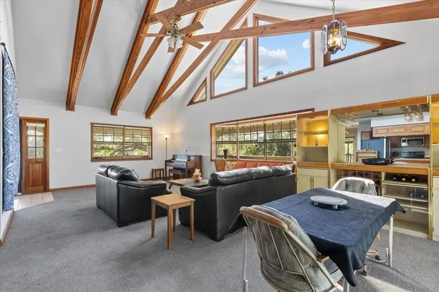 a kitchen with stainless steel appliances a refrigerator a sink a stove and cabinets