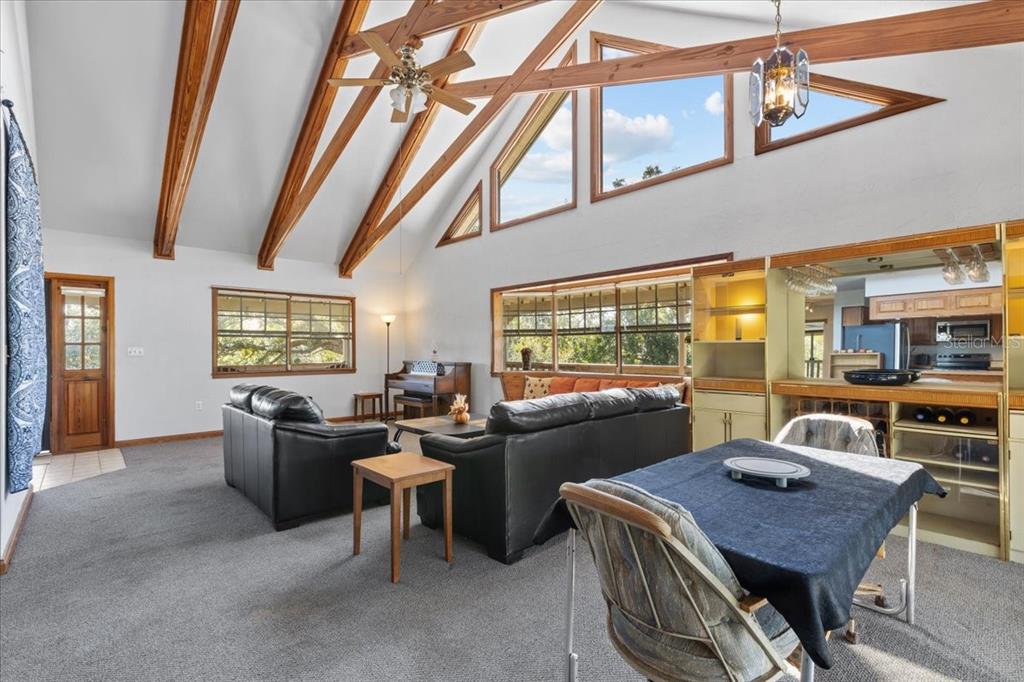 16791 Sandra Street Cedar Key, FL 32625 - Photo 18 of 50 a view of a dining room with furniture window and outside view