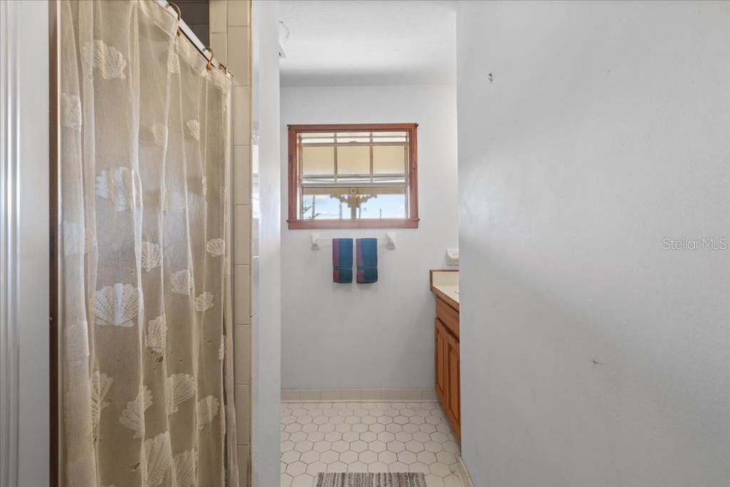 16791 Sandra Street Cedar Key, FL 32625 - Photo 27 of 50 a bathroom with a window