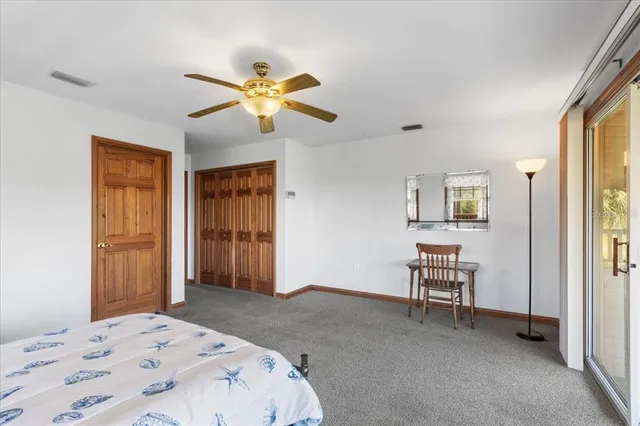 a view of a patio with table and chairs