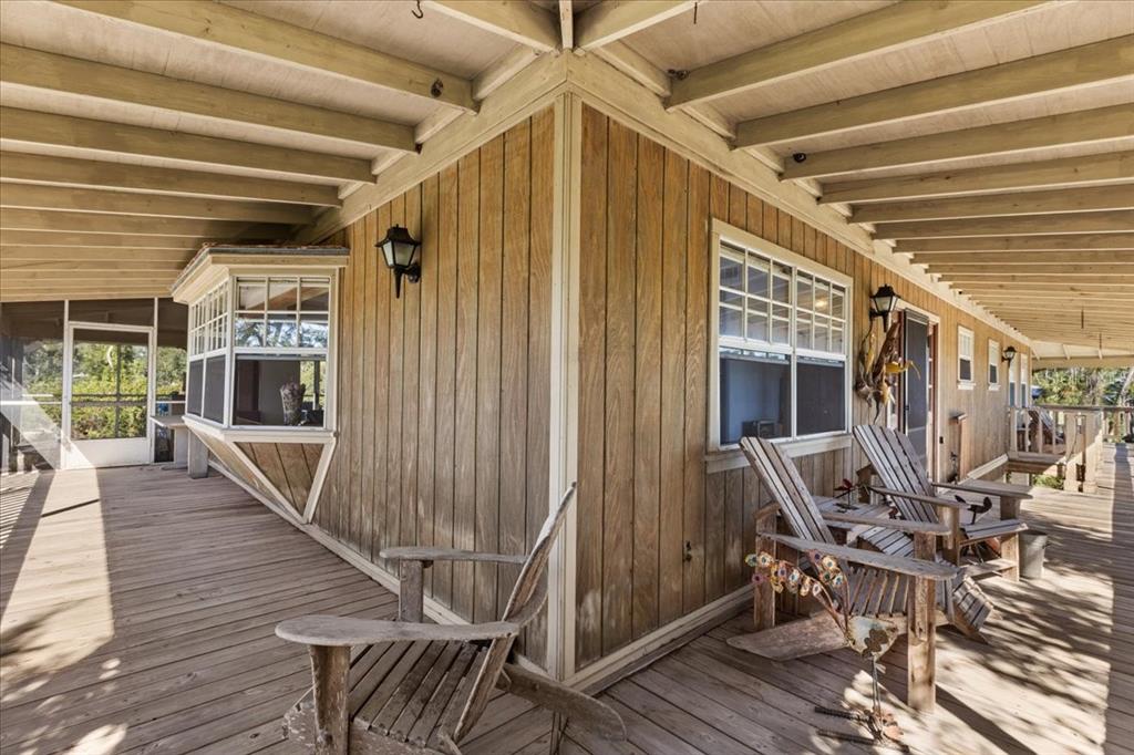 16791 Sandra Street Cedar Key, FL 32625 - Photo 33 of 50 a view of a patio with table and chairs