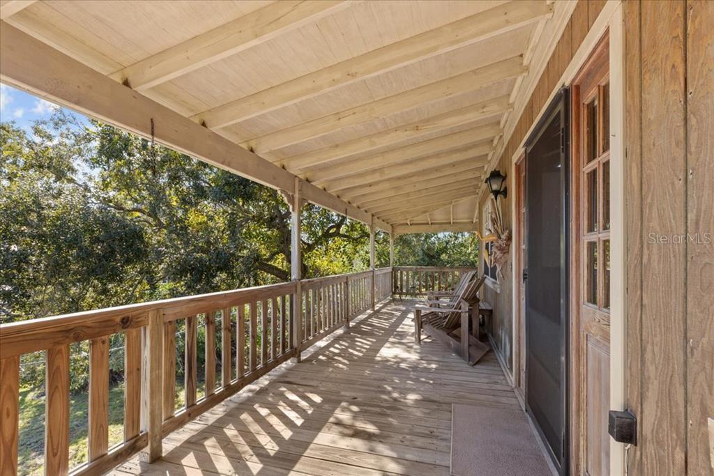 16791 Sandra Street Cedar Key, FL 32625 - Photo 34 of 50 a view of a balcony with wooden floor