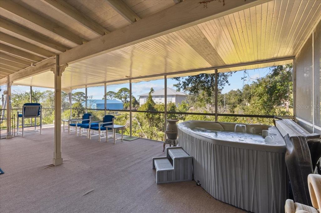 16791 Sandra Street Cedar Key, FL 32625 - Photo 37 of 50 a view of a patio with a table and chairs