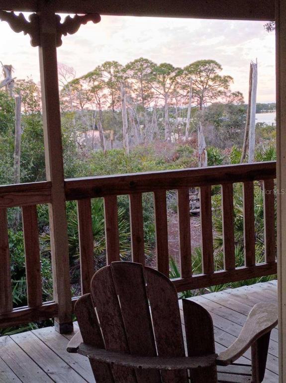 16791 Sandra Street Cedar Key, FL 32625 - Photo 42 of 50 a view of a balcony with furniture