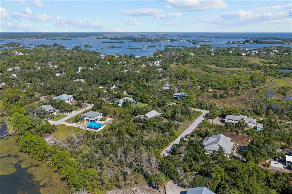 16791 Sandra Street Cedar Key, FL 32625 - Photo 44 of 50 an aerial view of a houses with a yard