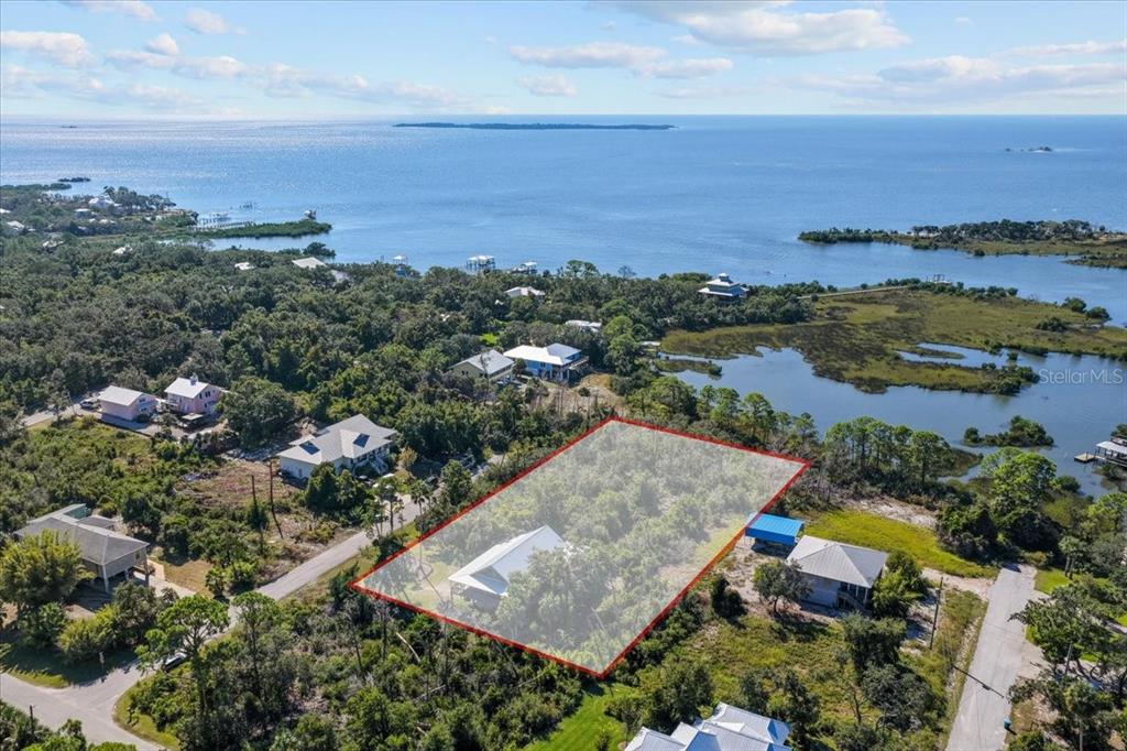 16791 Sandra Street Cedar Key, FL 32625 - Photo 47 of 50 an aerial view of residential houses with outdoor space