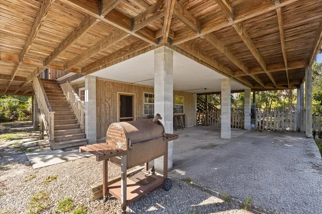 a view of a room with table and chairs
