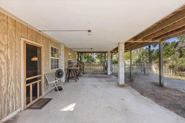 a view of a house with porch and sitting area