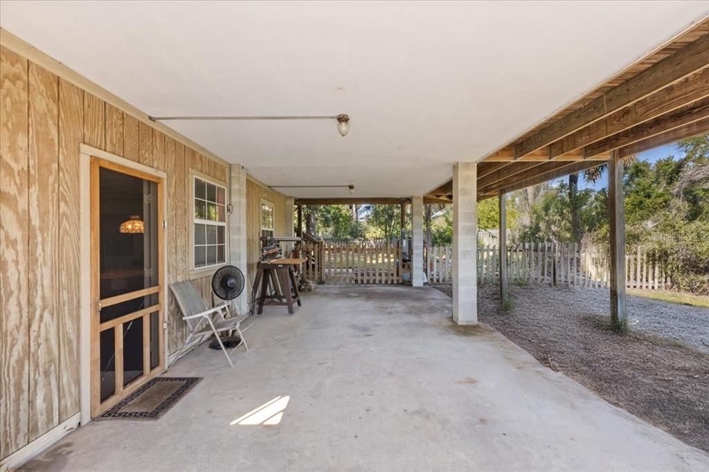 16791 Sandra Street Cedar Key, FL 32625 - Photo 10 of 50 a view of a room with gym equipment and floor to ceiling window