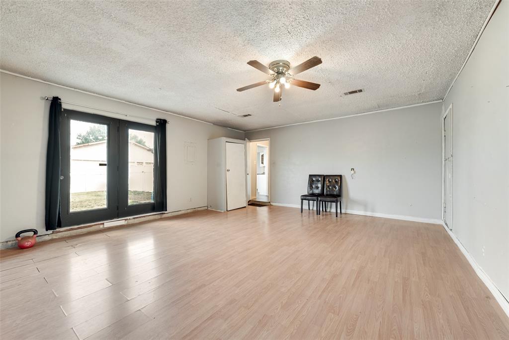 711 Valley Hill Road Duncanville, TX 75137 - Photo 14 of 20 a view of a livingroom with a ceiling fan and window